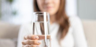 Woman drinking water.